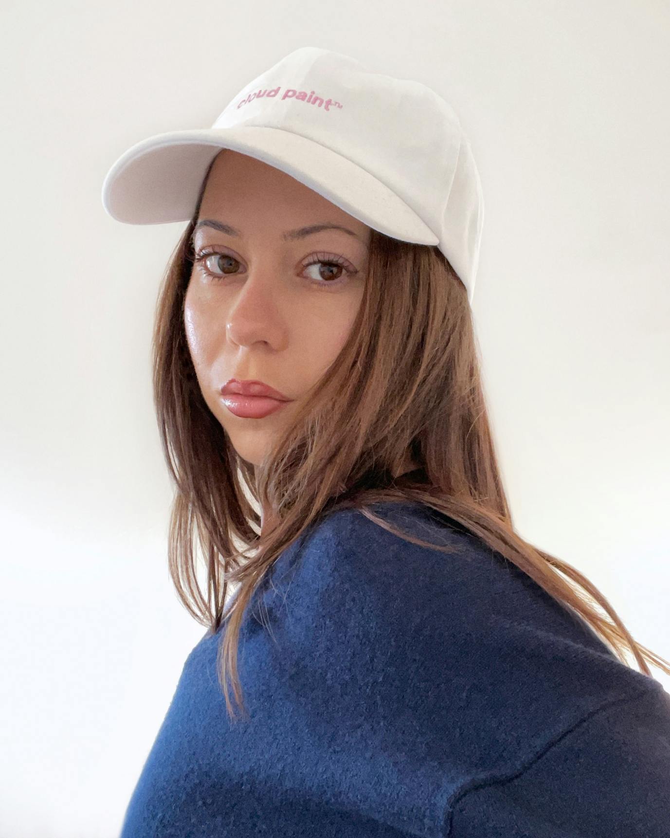 Brigitte wears our Cloud Paint Cap.