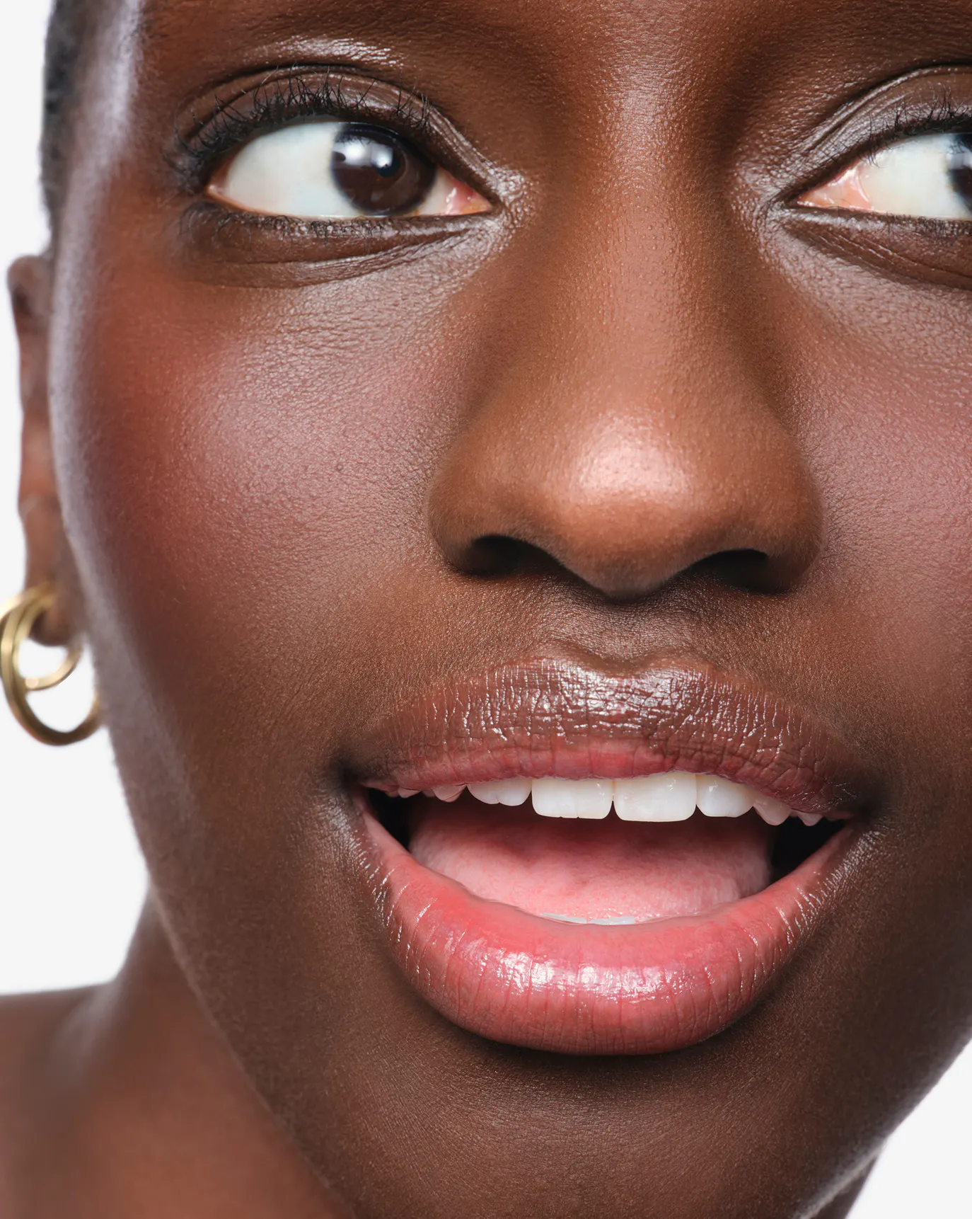 Mariama wears Wild Fig Balm Dotcom.