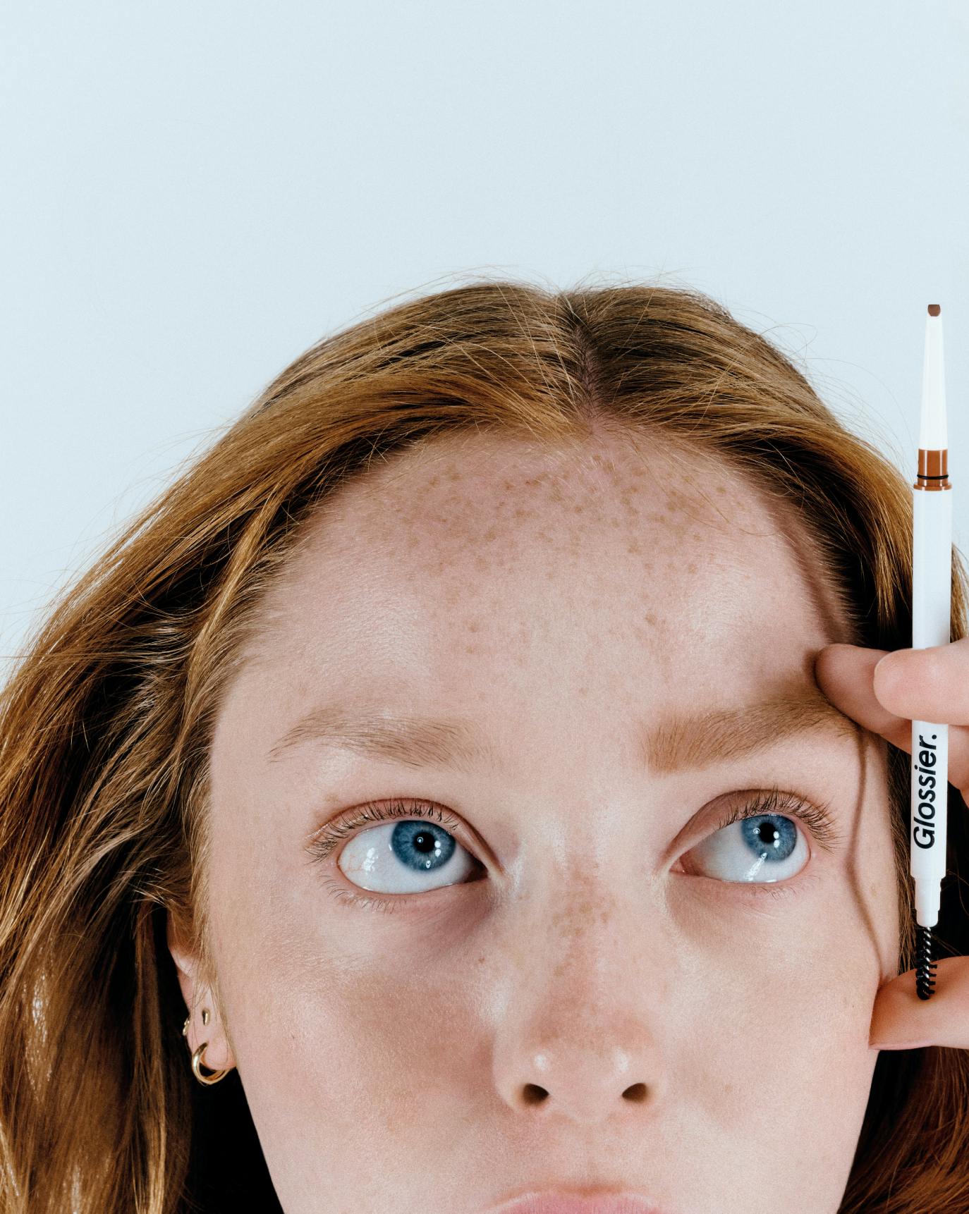 Charlotte wears Boy Brow Arch in Auburn.