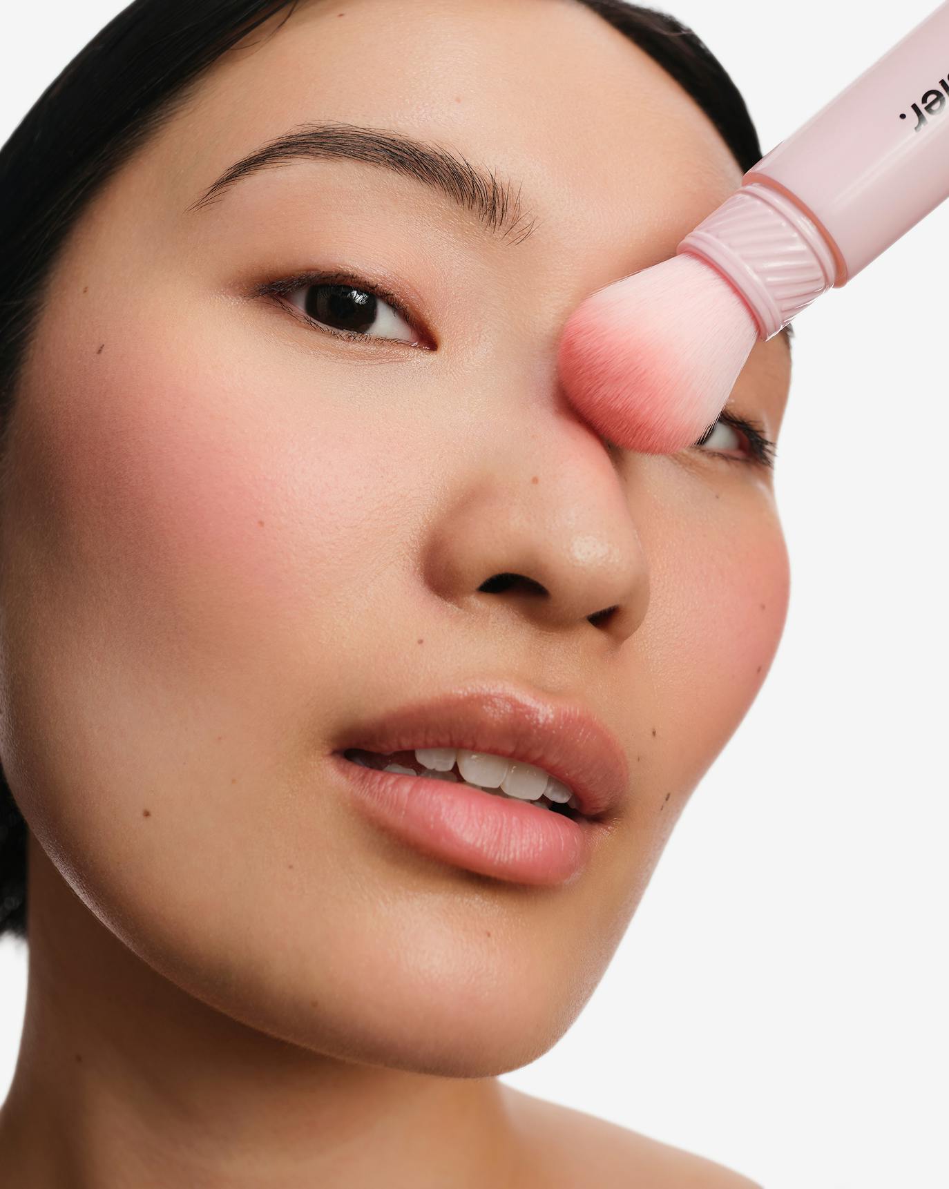 Chris wears Cloud Paint Plush Blush in Beam.