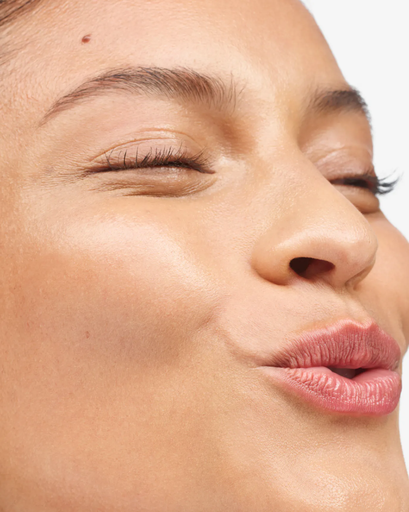 Nina in Stretch Balm Concealer, MT1.