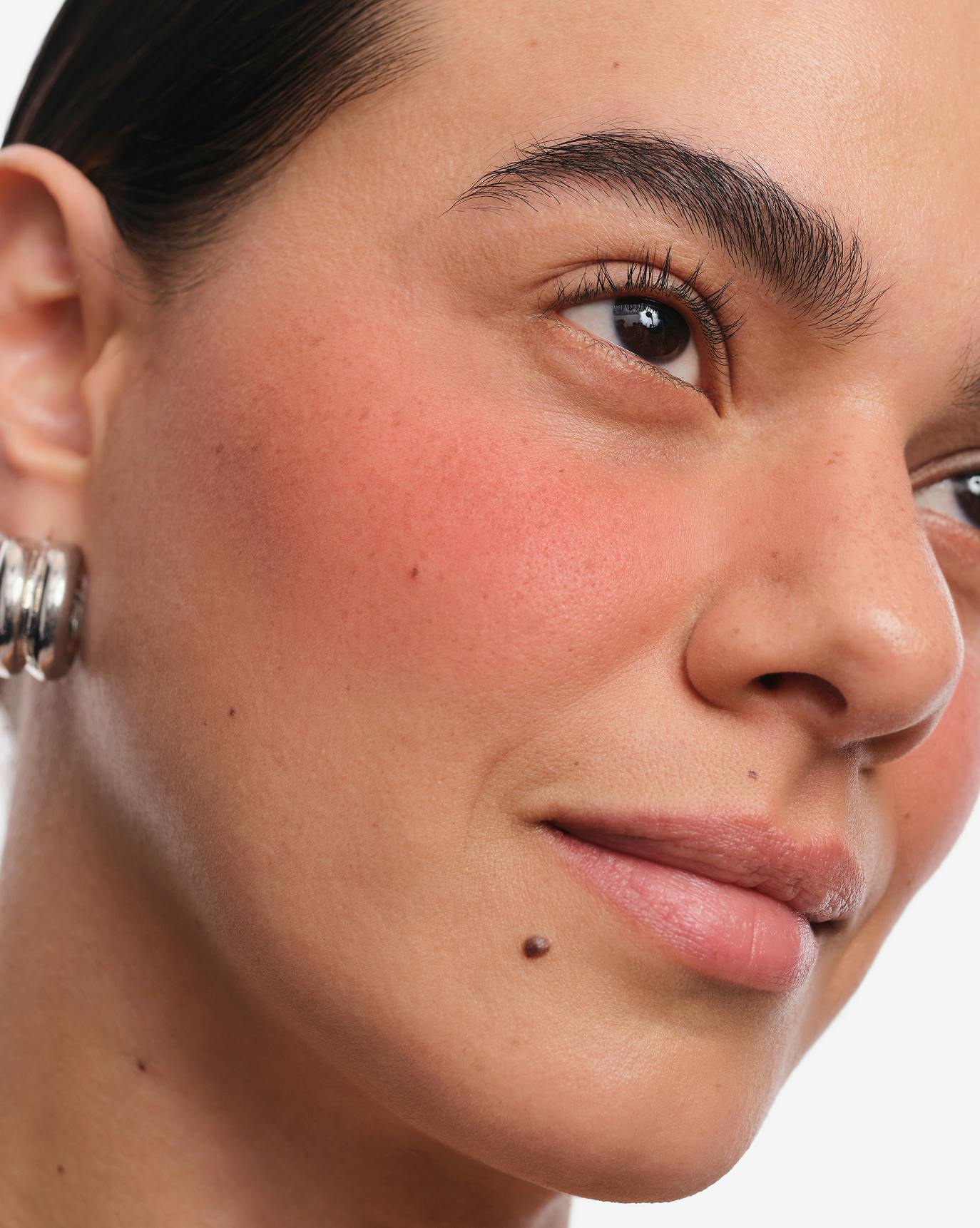 Joanna wears Cloud Paint Plush Blush in Burst.