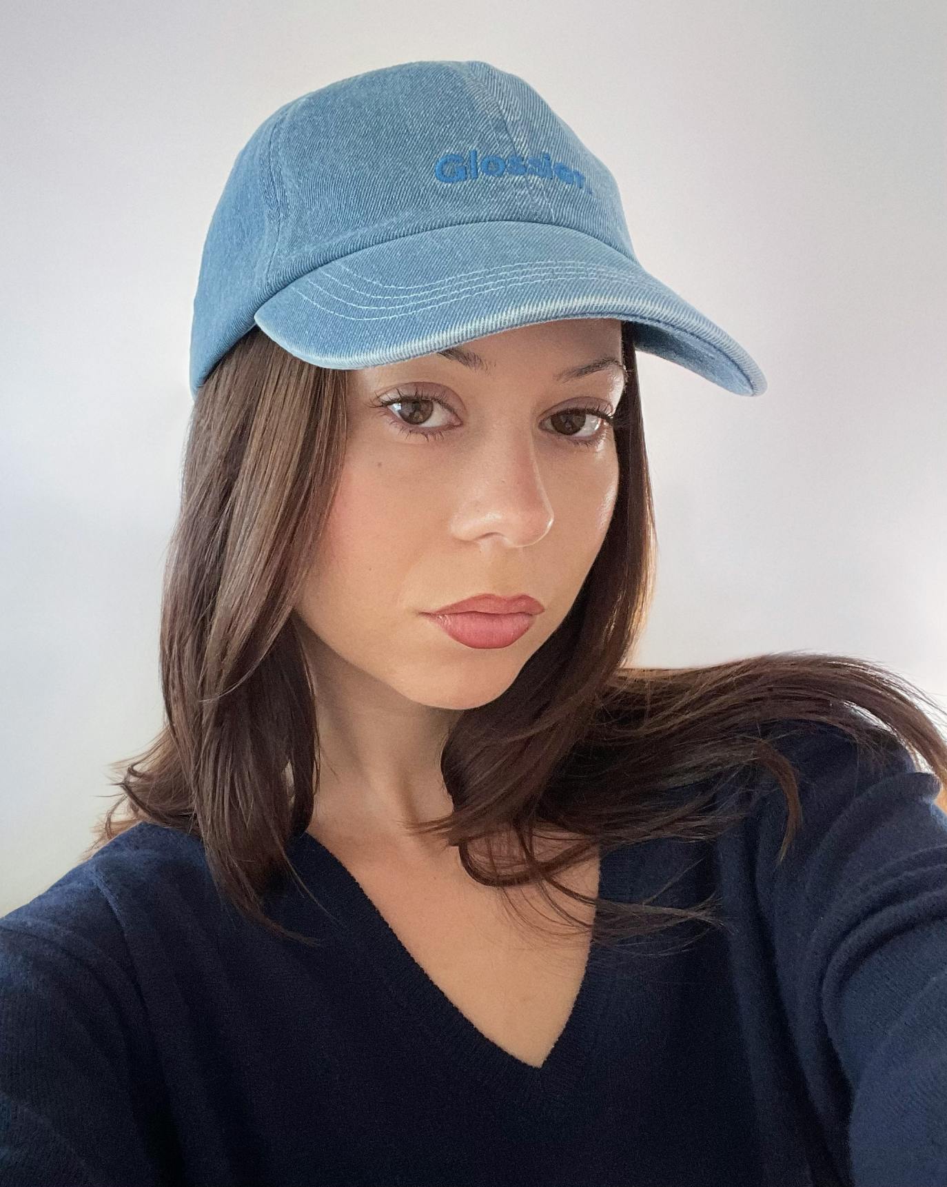 Brigitte wears our Classic Cap in Blue Denim.