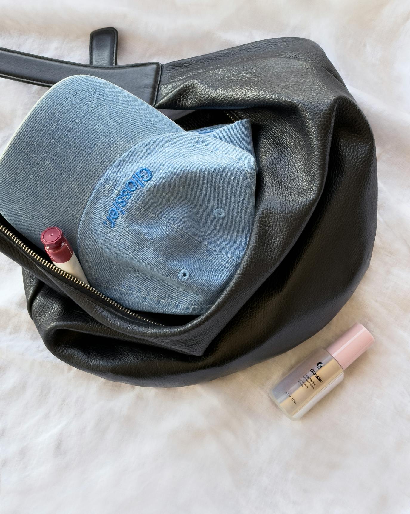 blue denim cap in purse with cloud paint and futuredew