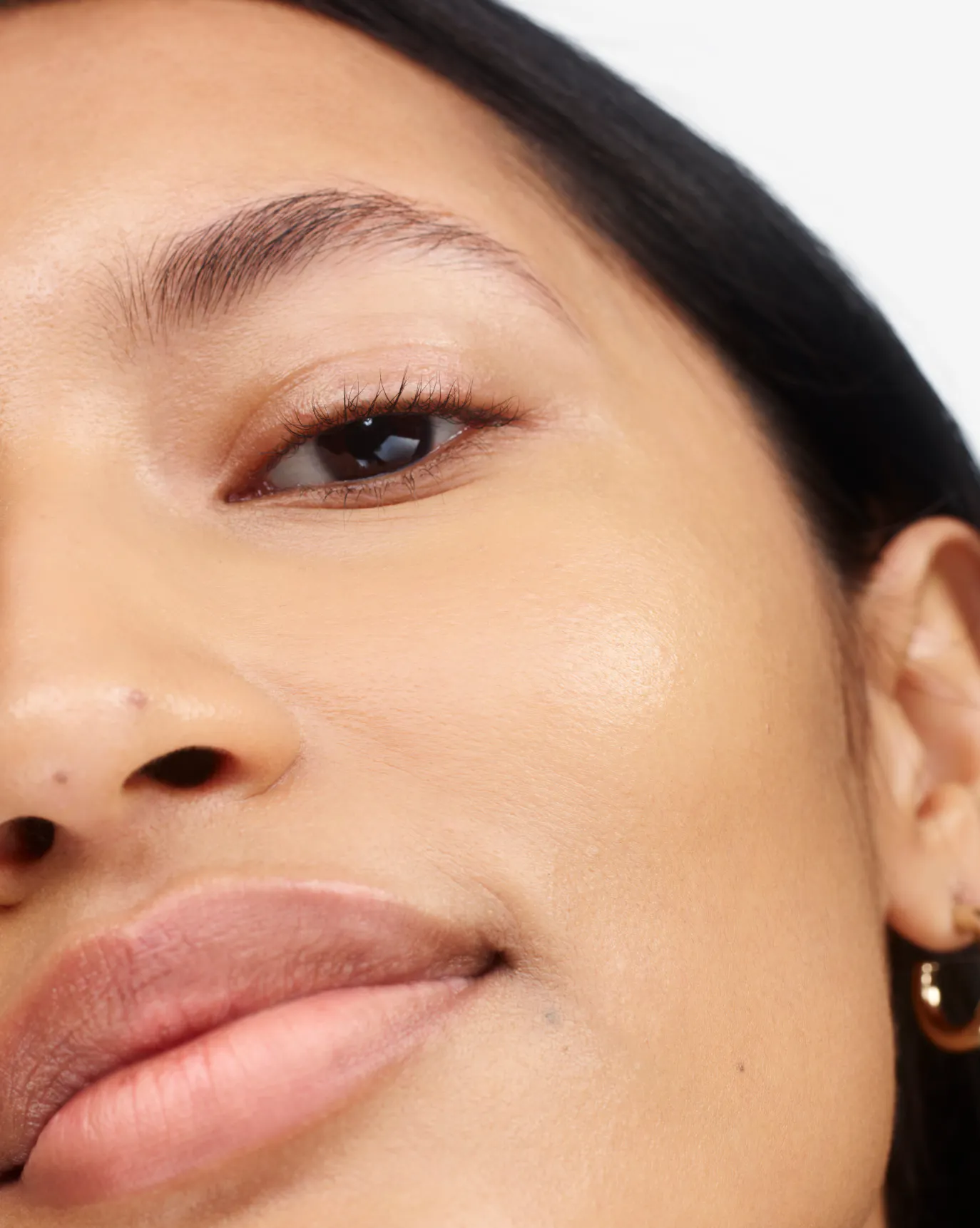 Thasfia in Stretch Fluid Foundation, MT1.