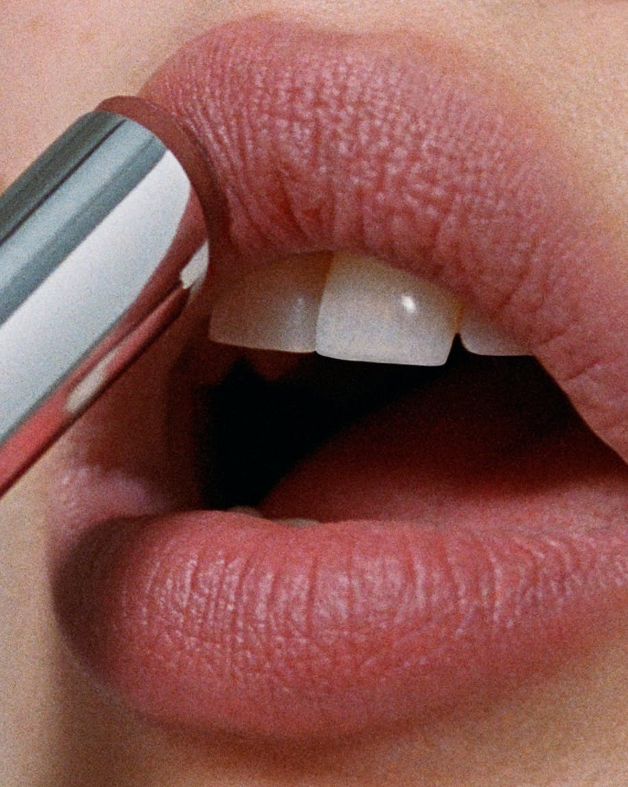 close up of model applying generation g in fuzz to lips