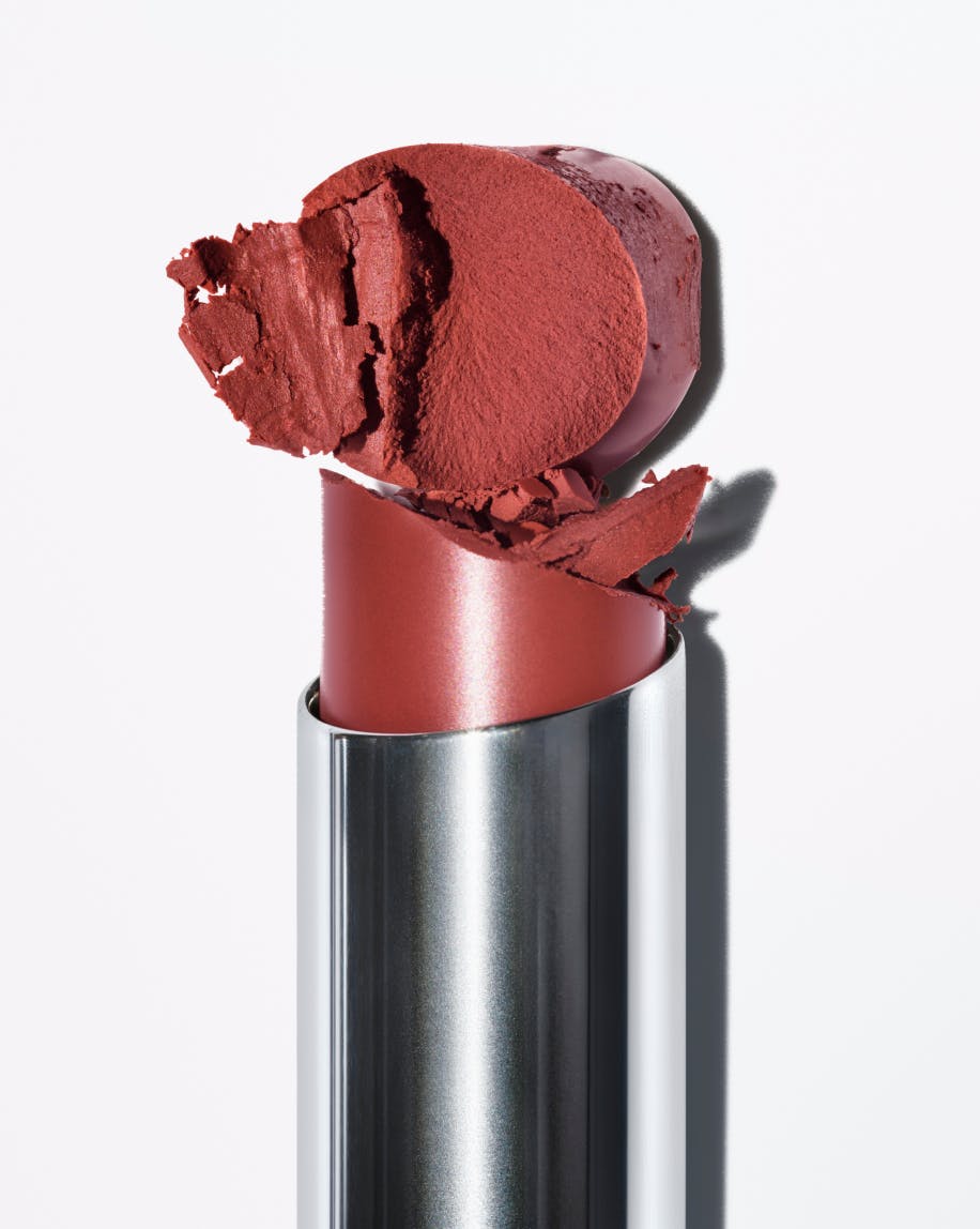 close up of generation g lipstick in fuzz coming out of tube