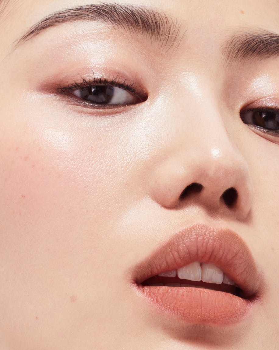 close up of person's face wearing generation g in leo on lips