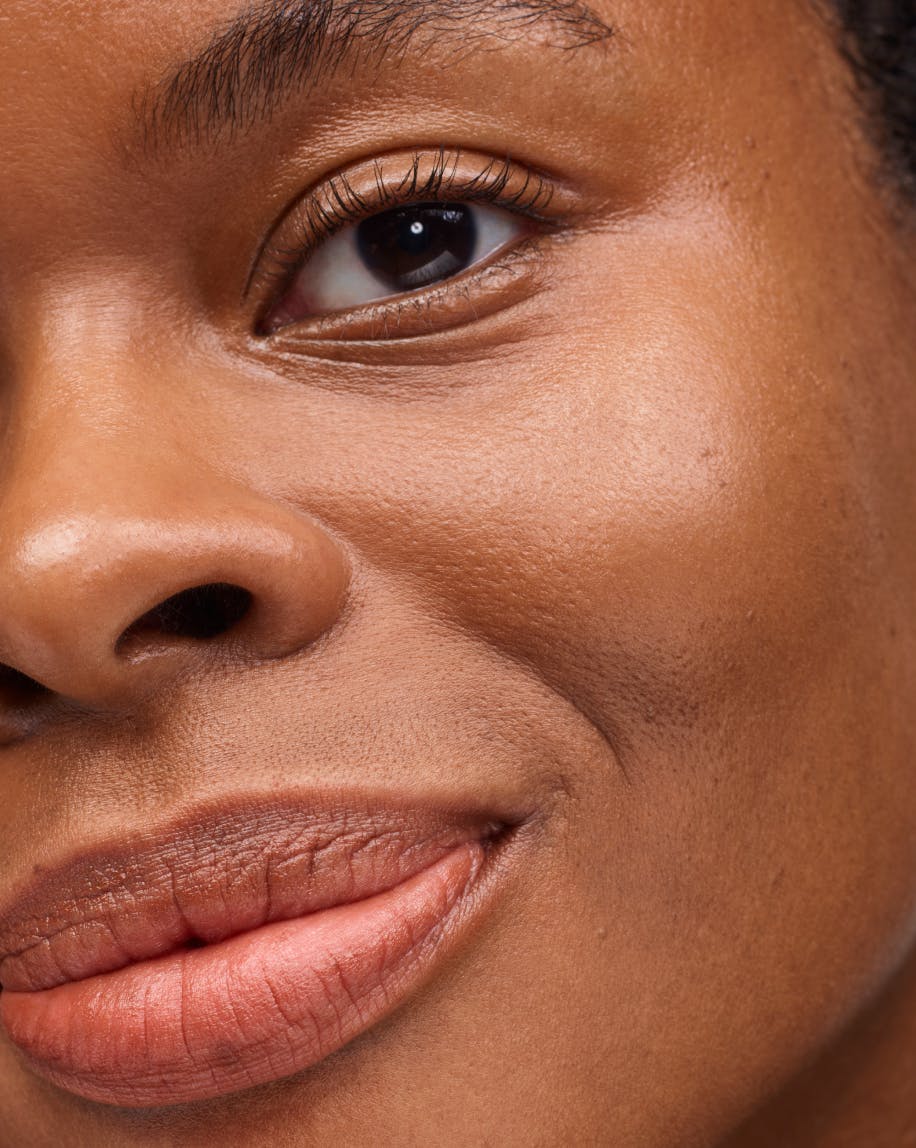 close up image of half model's face wearing generation g in malt