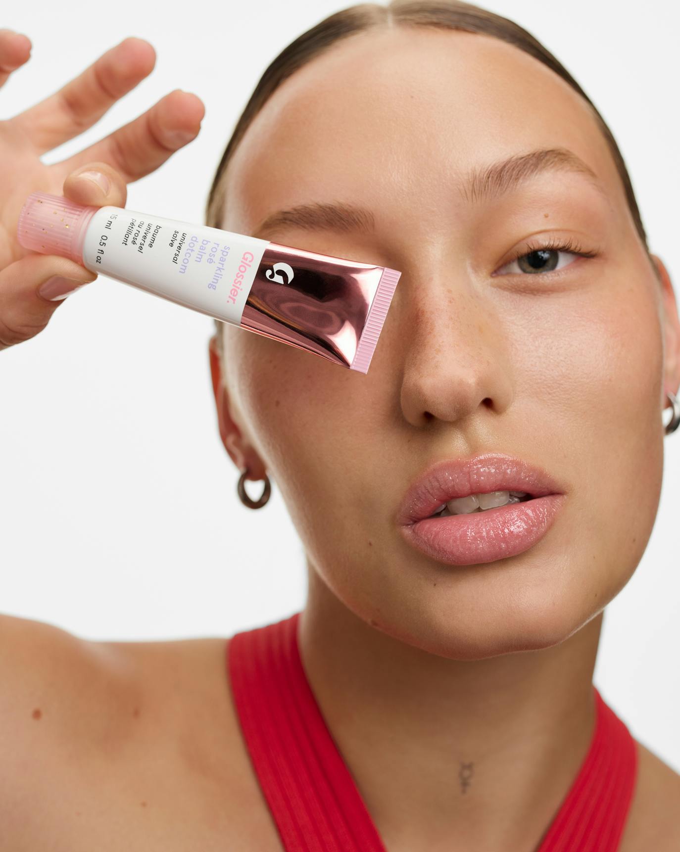 Sasha wears Sparkling Rosé Balm Dotcom.