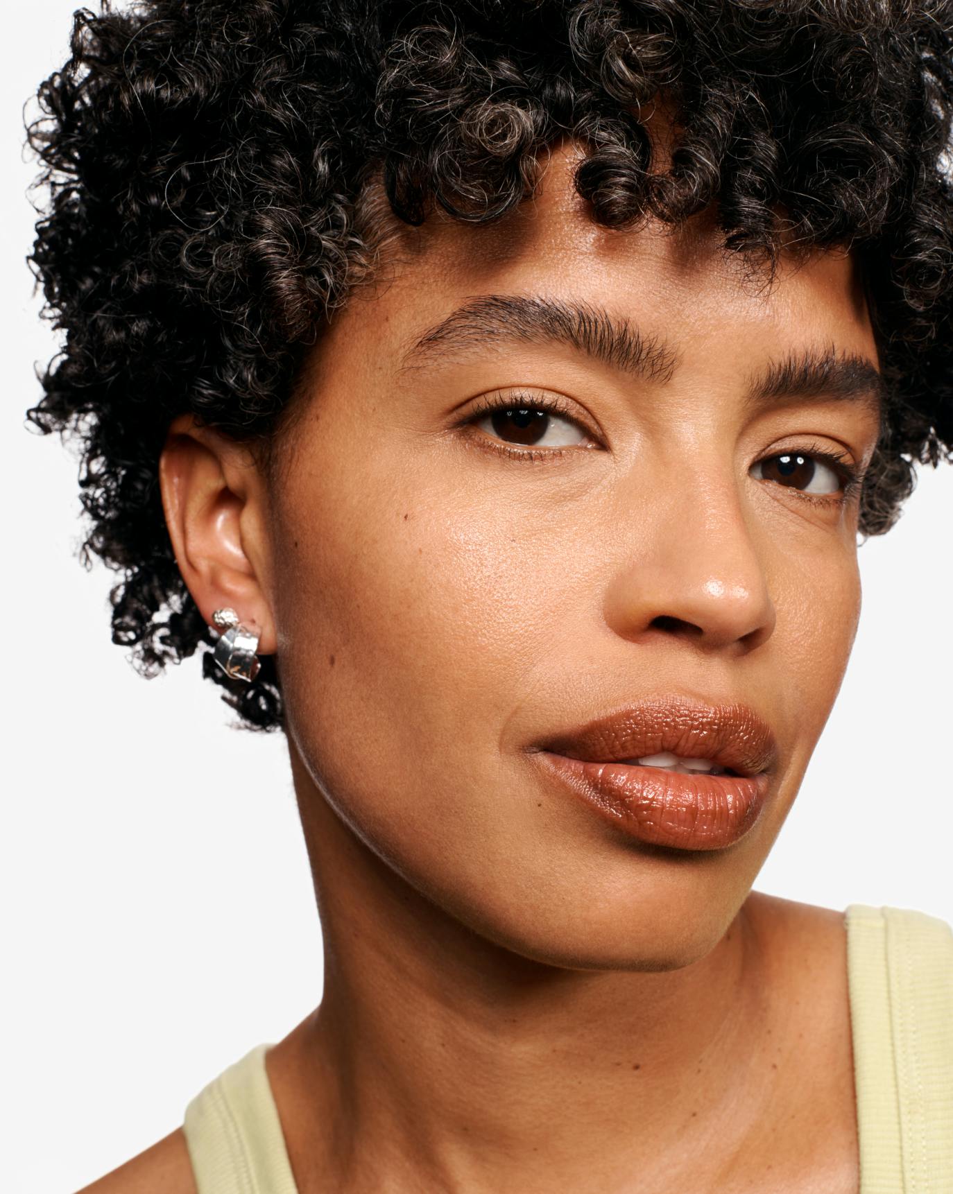 Selena wears Espresso Balm Dotcom.