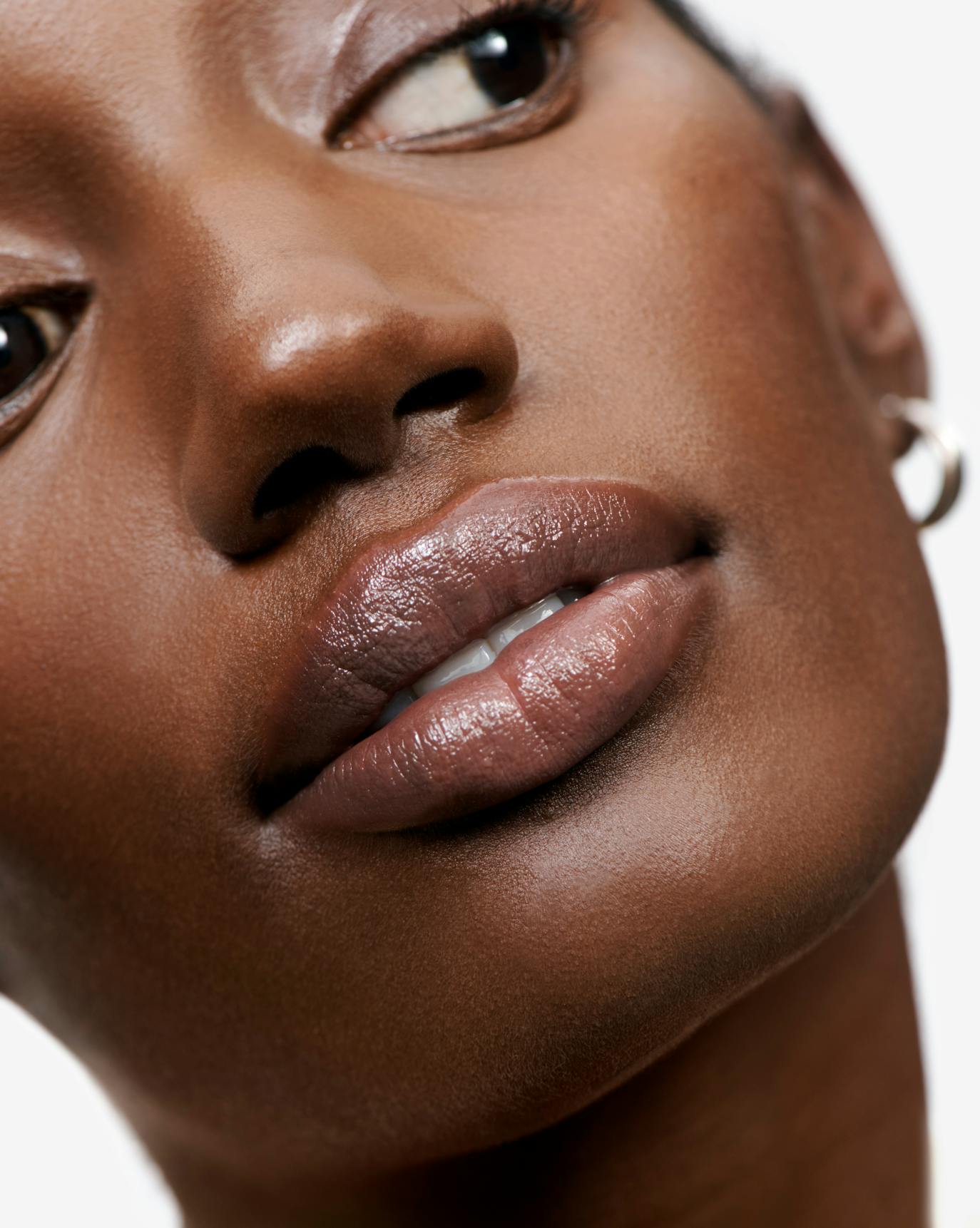 Brenda wears Lip Glaze in Icy.