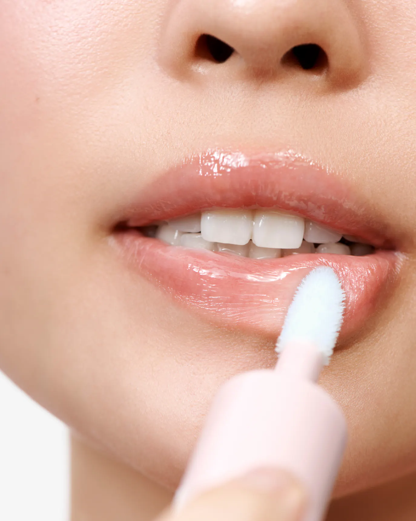 Alison wears Lip Glaze in Icy.