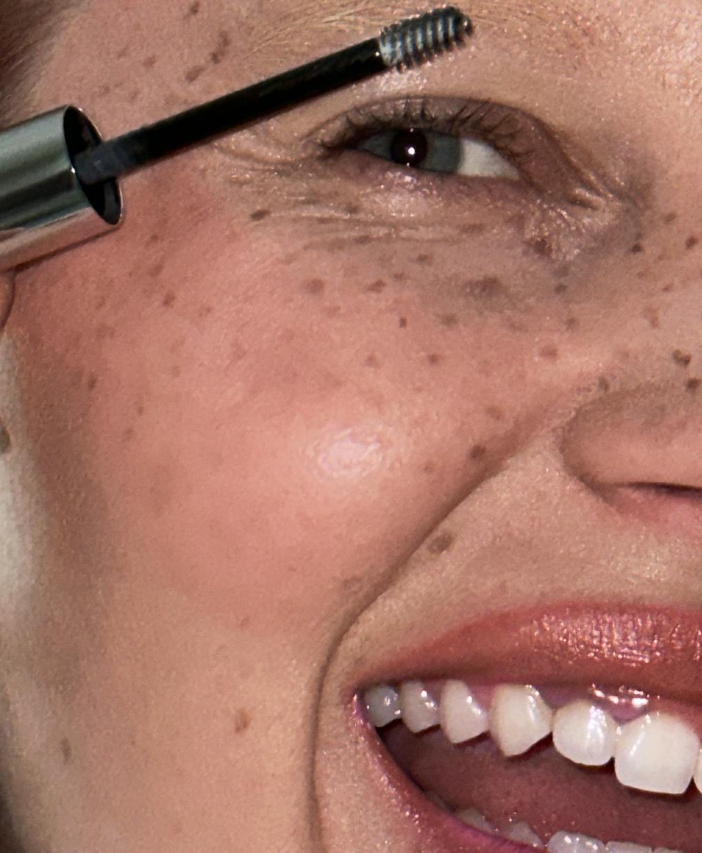 Nasra wears Boy Brow in Dark Brown.