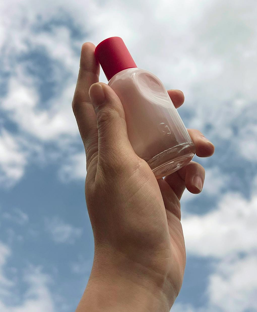 model holding perfume