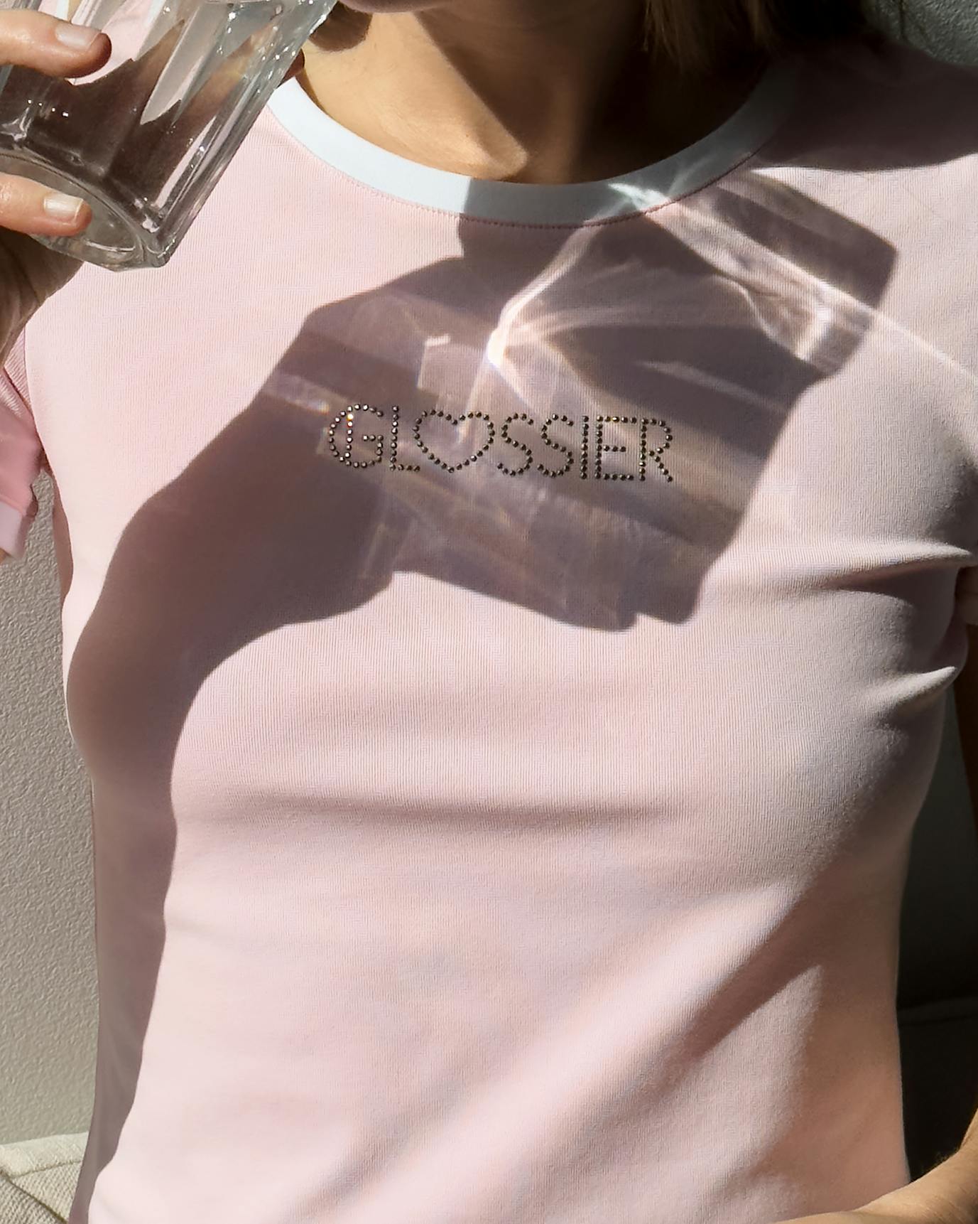 Anna wears the Las Vegas Baby Tee.