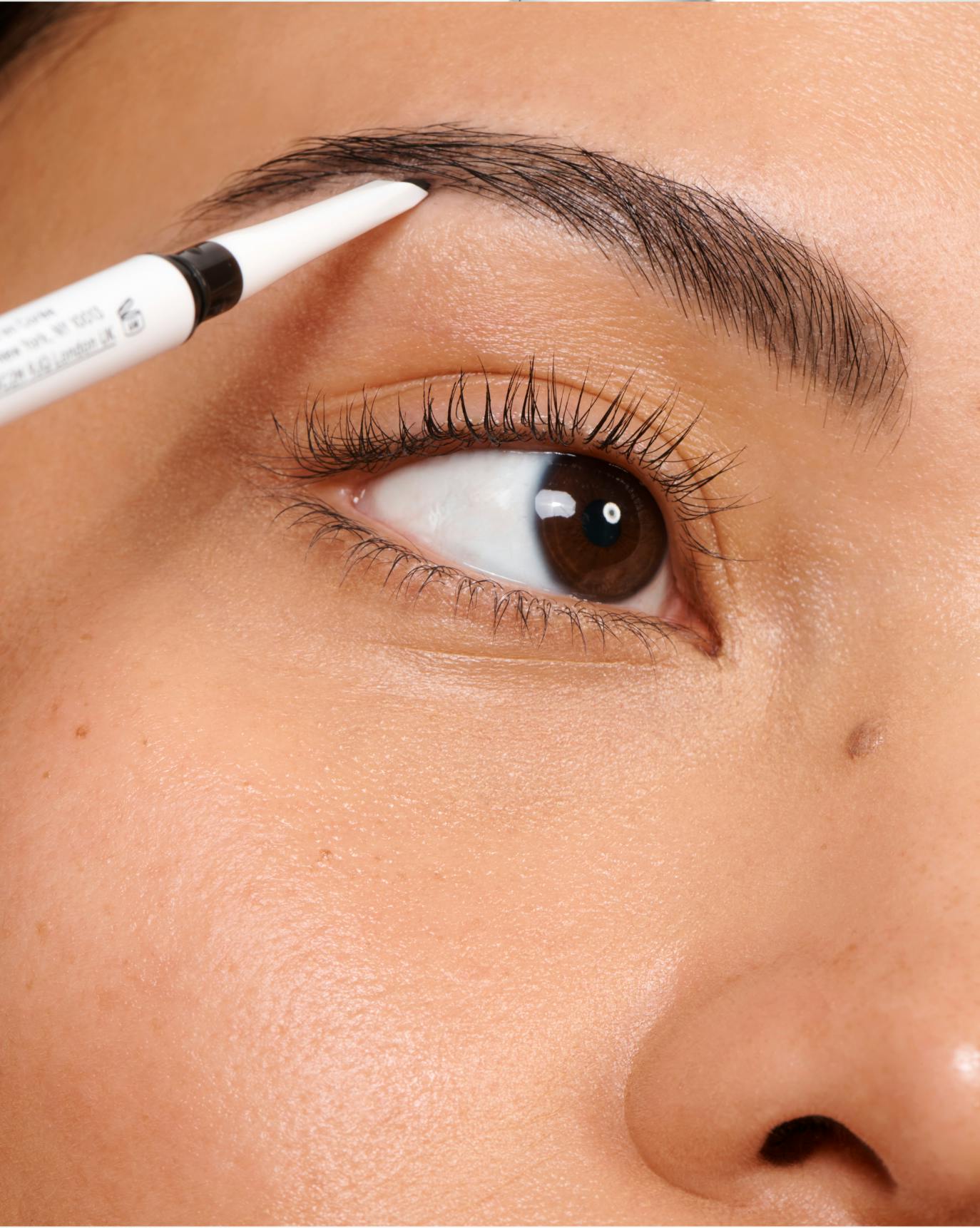 Kylie wears Boy Brow Arch in Black.